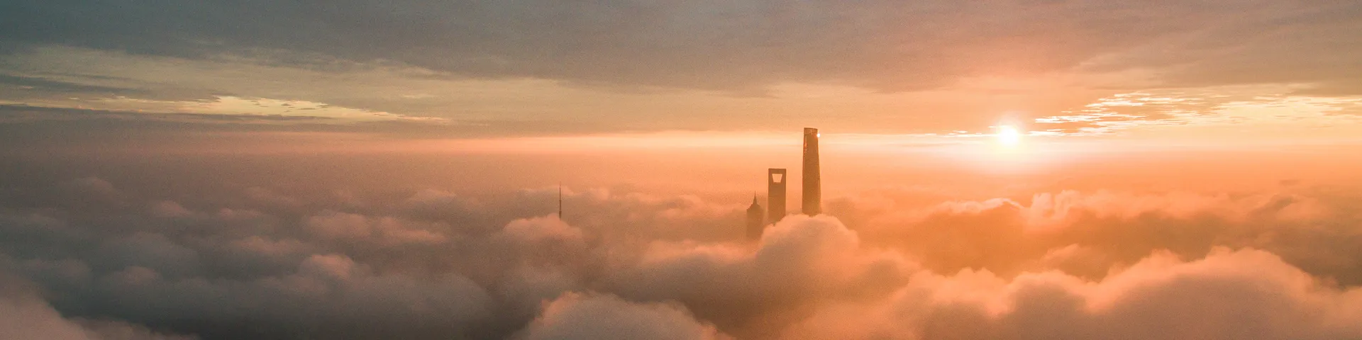 Aeriel view of the skyscrapers above the clouds in the Lujiazui at sunrise, Shanghai 