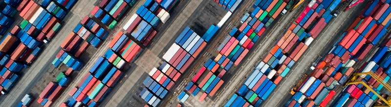Shipping containers sit stacked in this aerial photograph taken above a port in South Korea. Photographer: SeongJoon Cho/Bloomberg