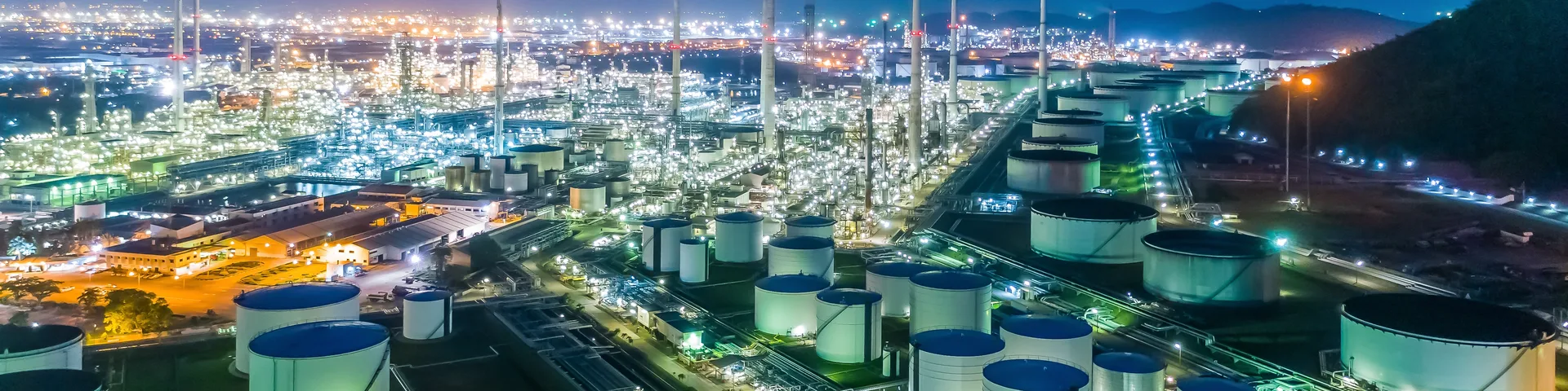 Aerial top view Oil refinery factory at night for energy or gas industry background